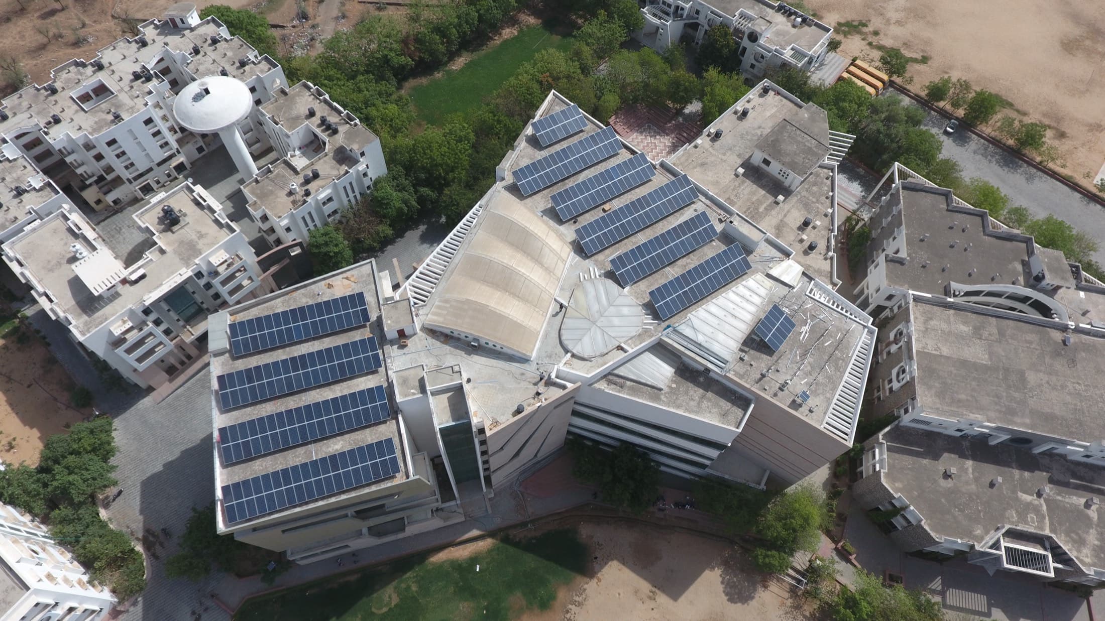 Rooftop solar arrays on a university campus in Jaipur, from the air