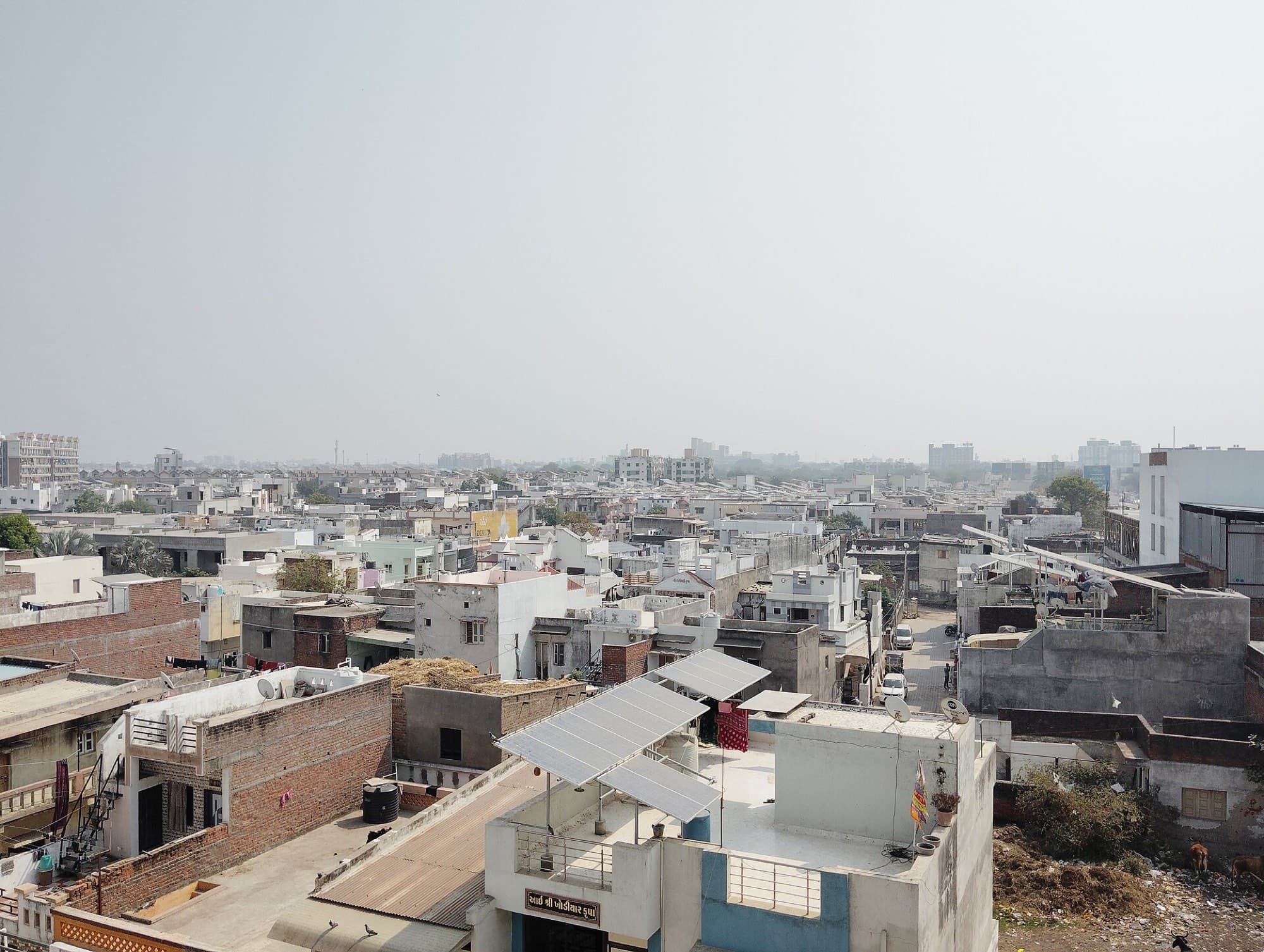 A small rooftop array on a home in Mehsana, Gujarat, the size the ₹17,000 top-up was designed around