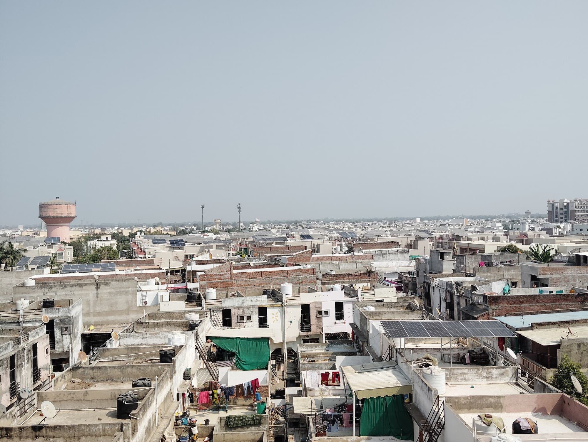 Rooftop arrays across a dense Indian neighbourhood, Mehsana, Gujarat