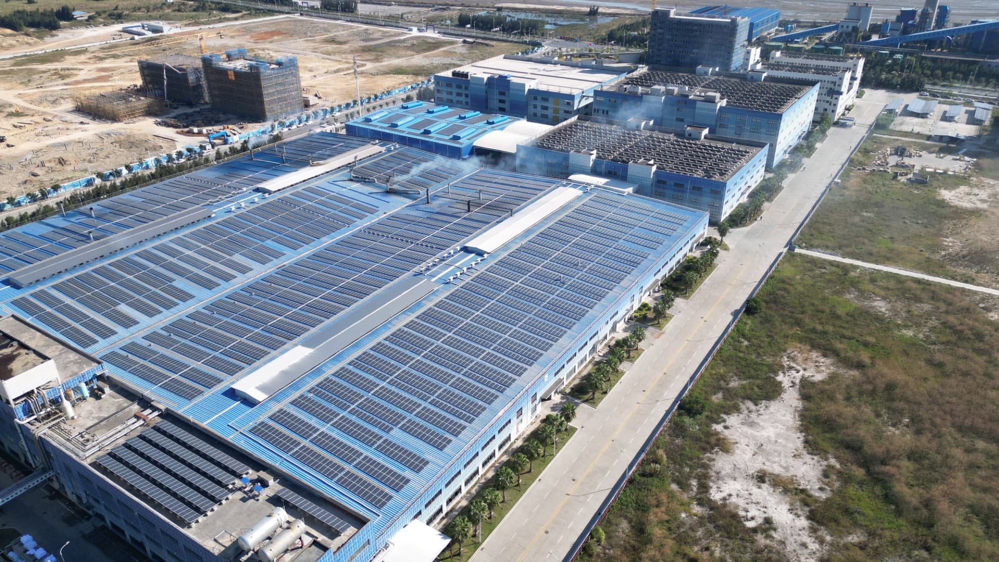 Aerial view of solar arrays across an industrial park